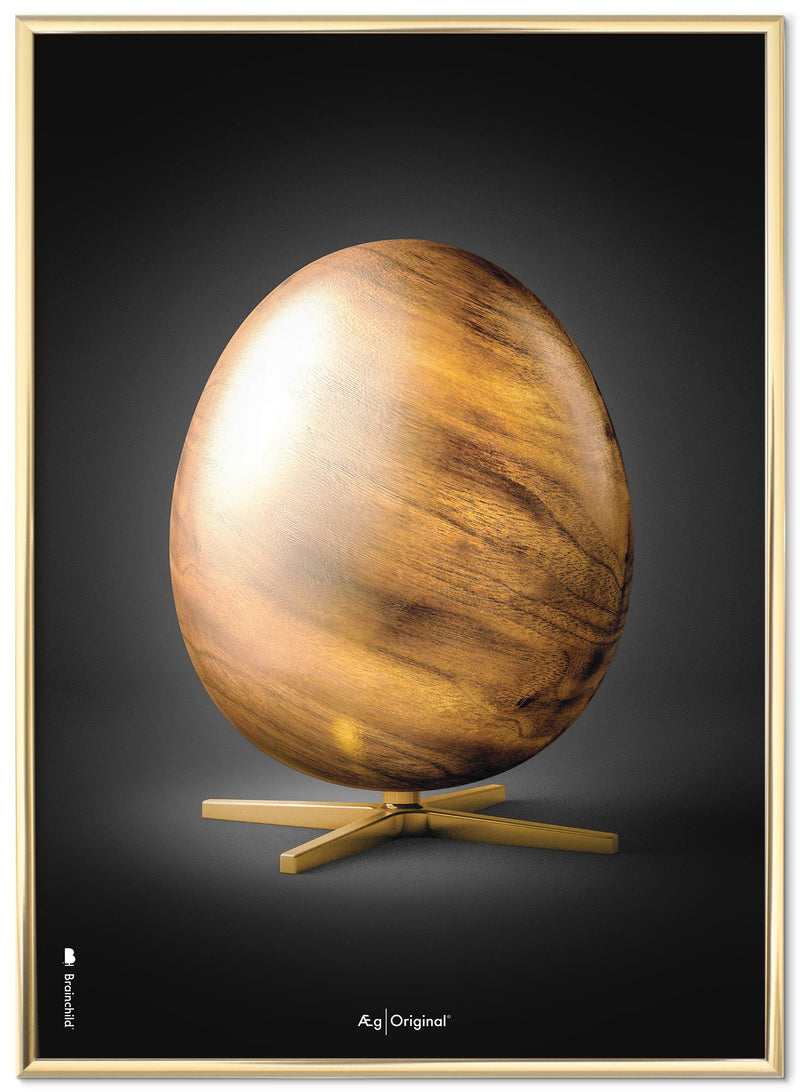 Brainchild plakat med træ æg, sort baggrund, indrammet i guld plakatramme